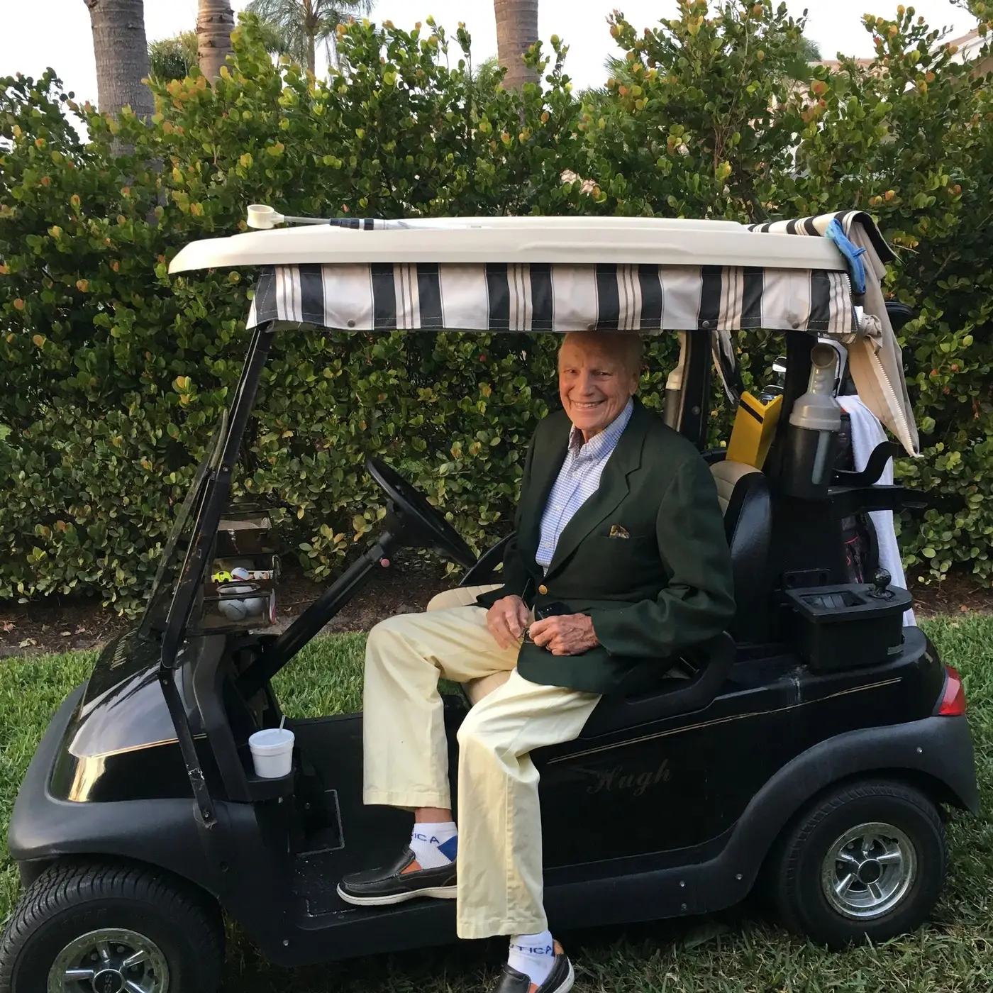 Matt Yorgey's grandfather Hugh Connett, seated in a golf cart